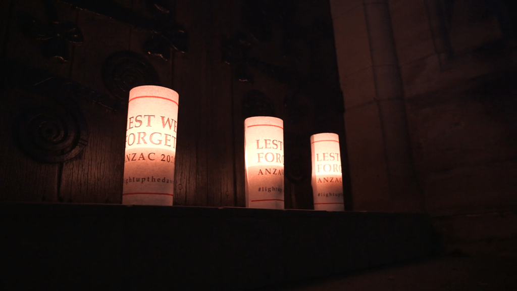 3 candles each with Lest We Forget inscribed on them