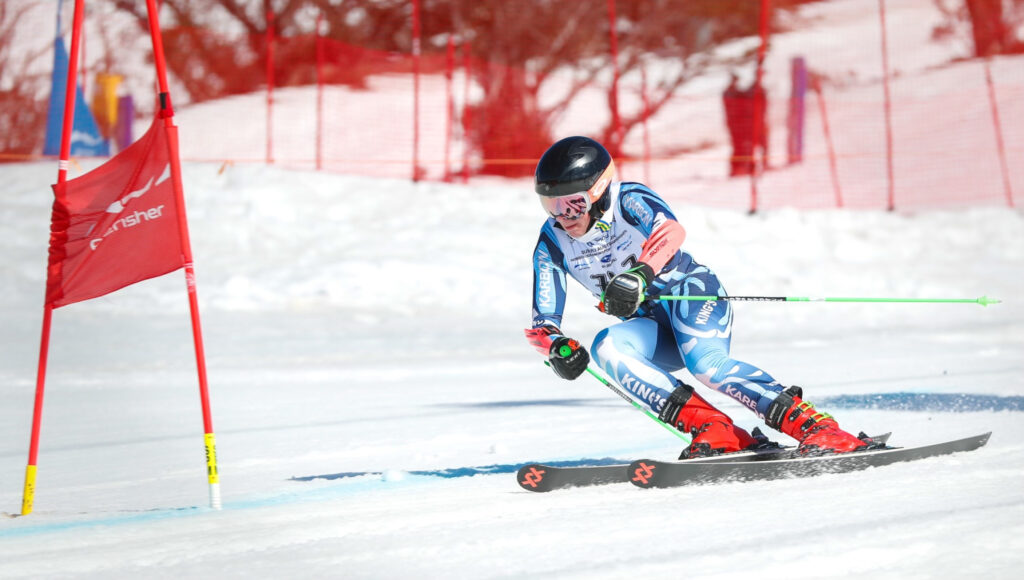 King's student skiing on snow down a hill